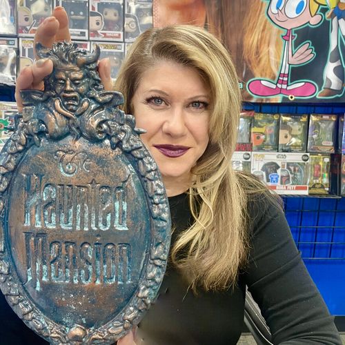 Kat Cressida with Haunted Mansion shield