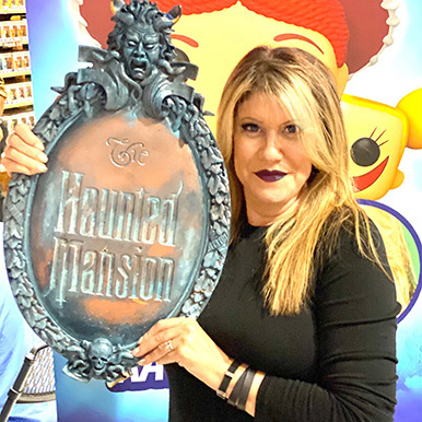 Kat Cressida with Haunted Mansion shield