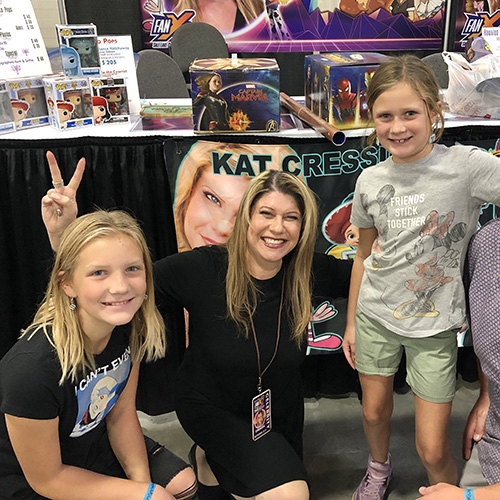 Kat Cressida with 2 young fans