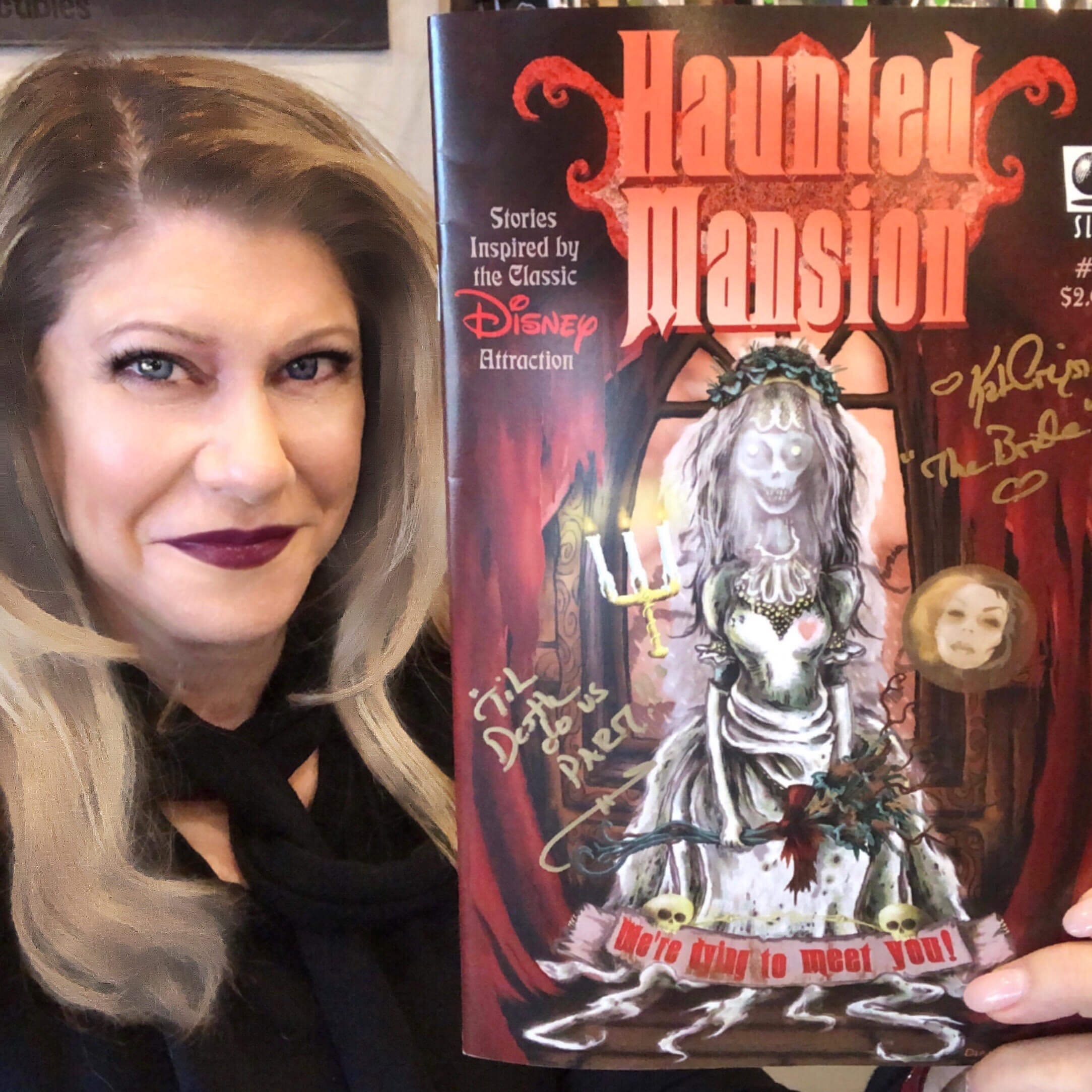 Kat Cressida with autographed Haunted Mansion booklet