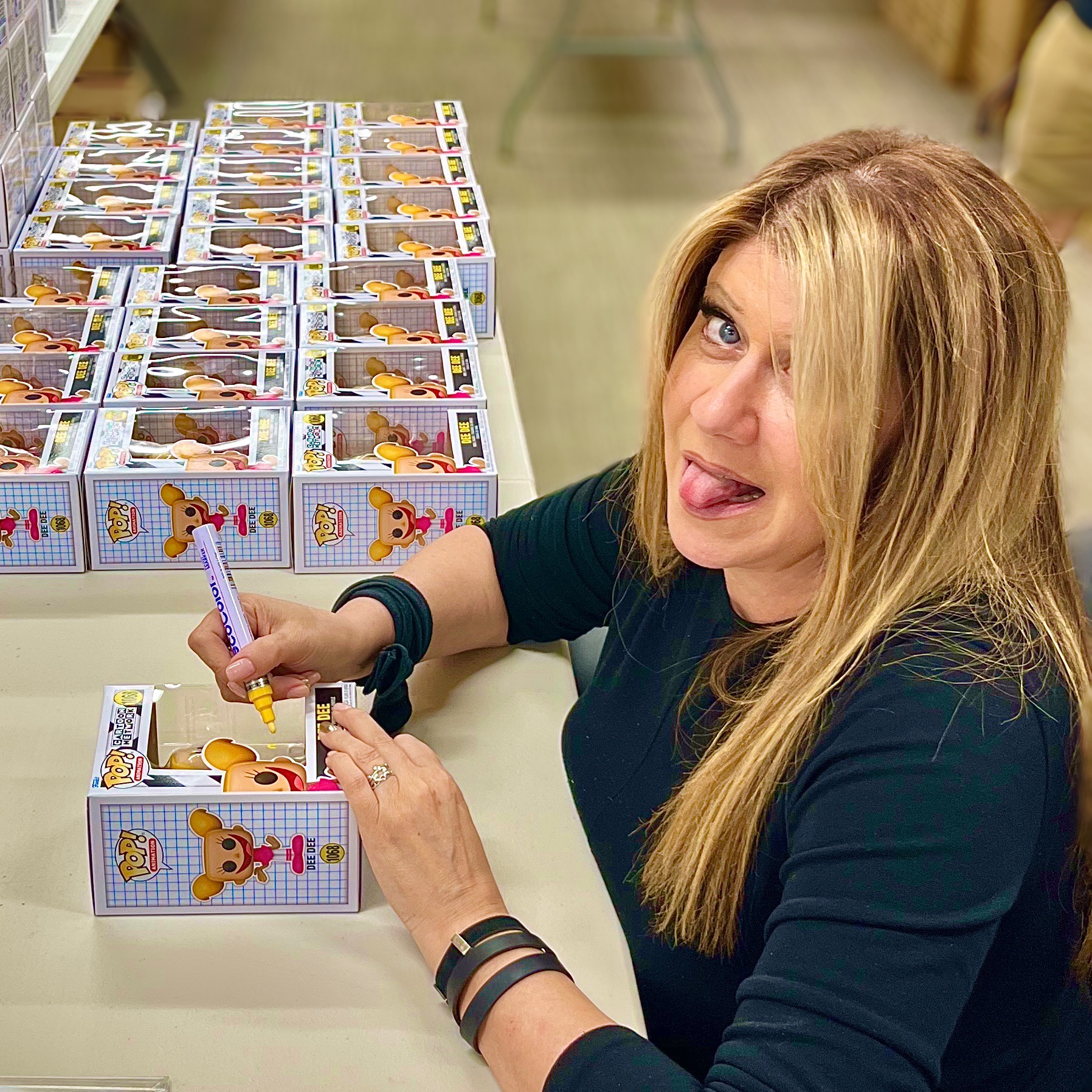 Kat Cressida at fan Funko Pop signing event at Chalice Collectibles autographing hundreds of Dexter’s Laboratory collectibles